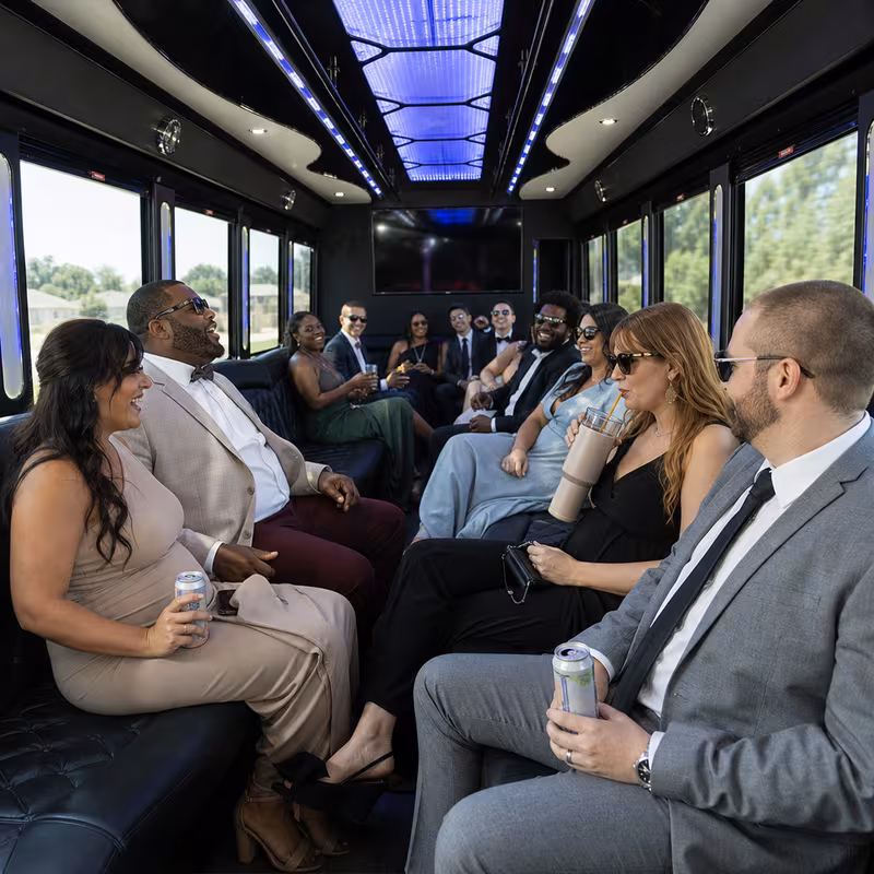 Wedding guests seated inside a Baton Rouge party bus
