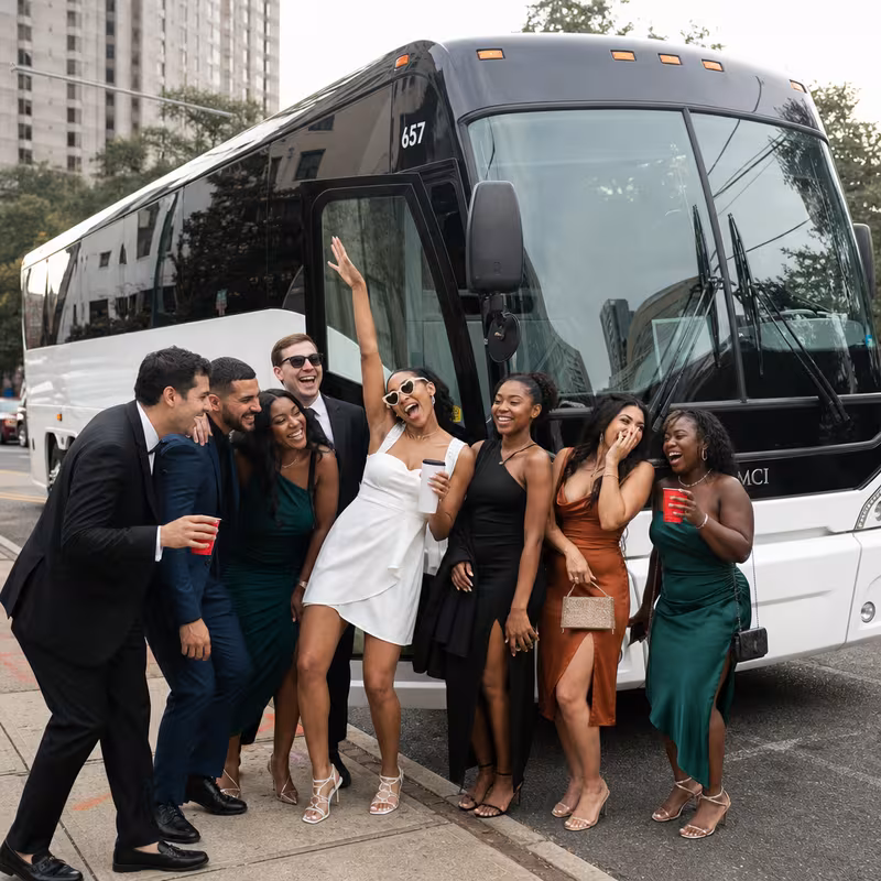 Passengers loading luggage while boarding an Baton Rouge group shuttle