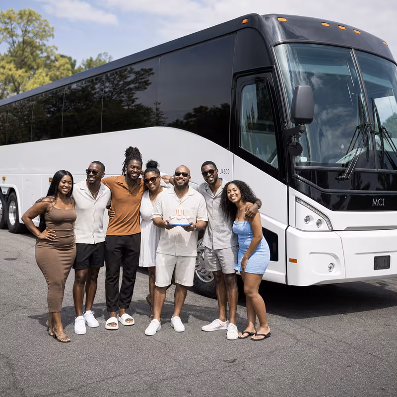 Passengers loading luggage while boarding an Baton Rouge group shuttle