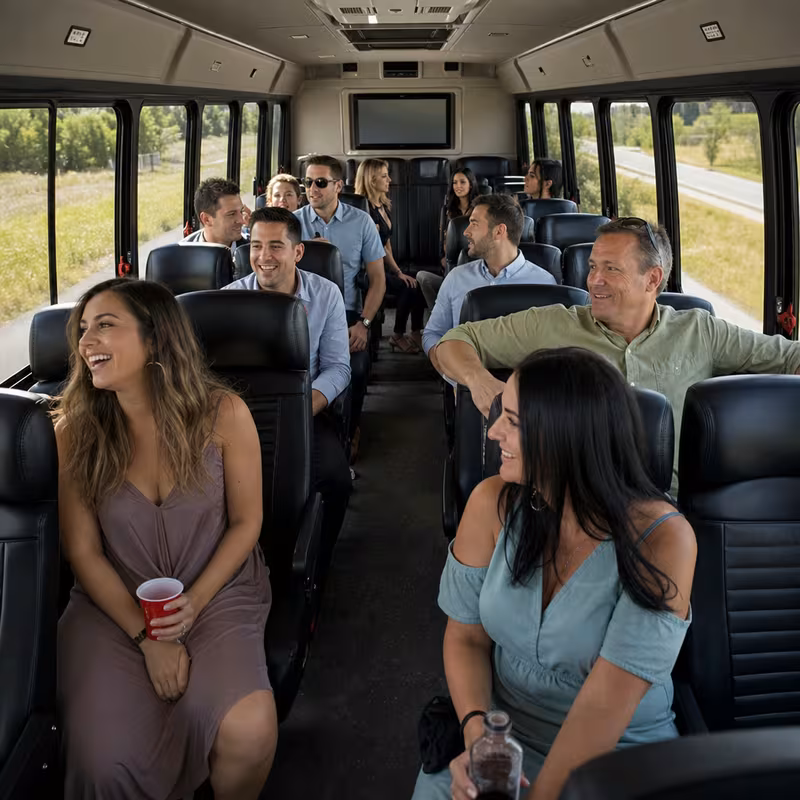 Group boarding a white charter bus for Private Event Transportation transportation in Baton Rouge