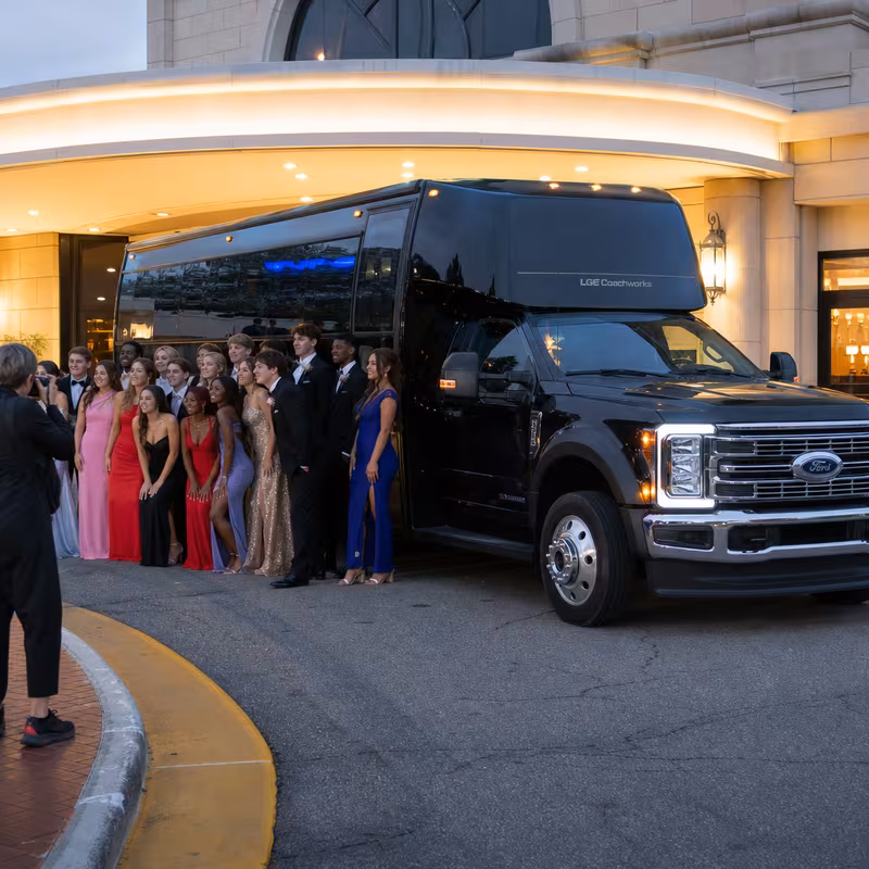 Party bus interior with wraparound leather seating and LED lighting in Baton Rouge