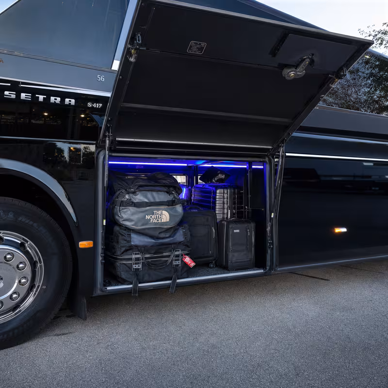 Party bus interior with wraparound leather seating and LED lighting in Baton Rouge
