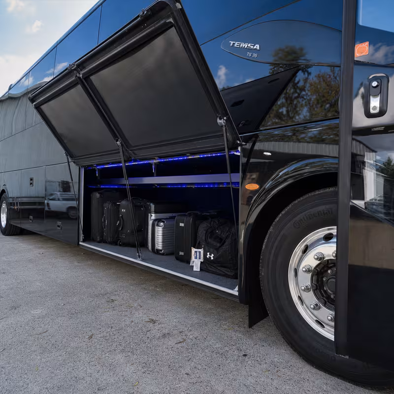 Party bus interior with wraparound leather seating and LED lighting in Baton Rouge