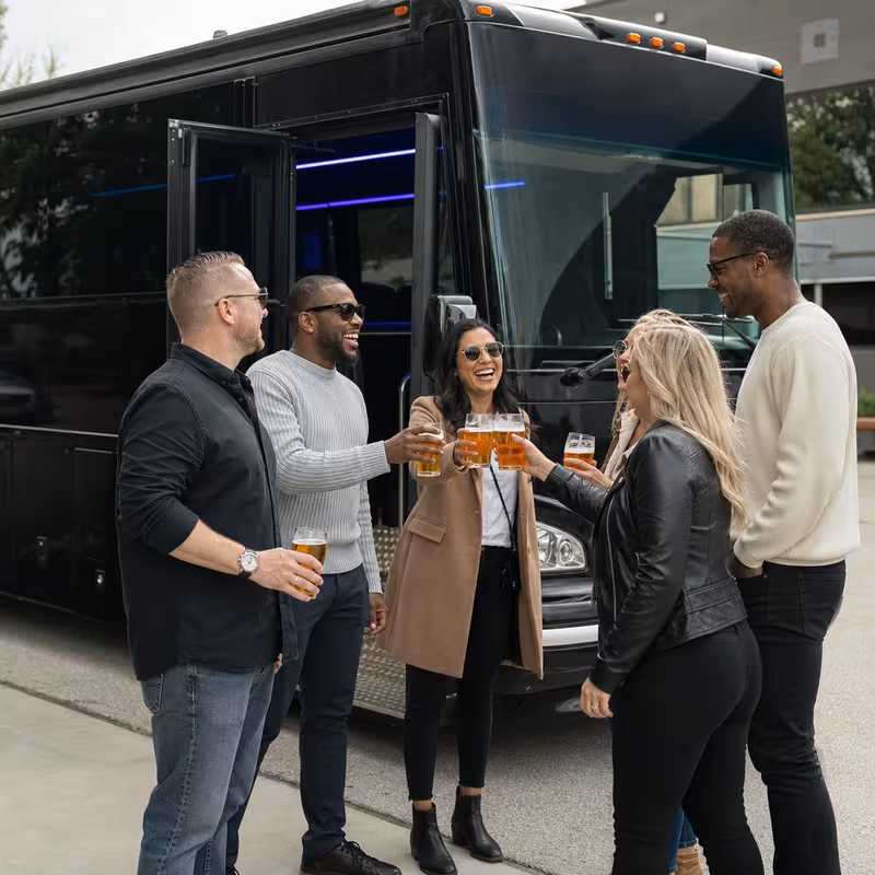 Passengers loading luggage while boarding an Baton Rouge group shuttle